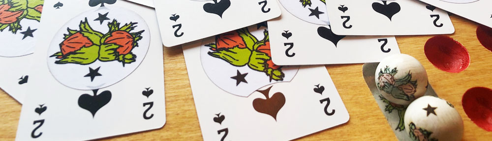 Cartes de "Deux de Pique" et billes "Noisettes étoilées"